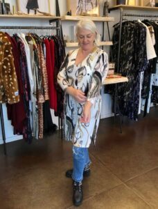 Ester checking out designer clothes at Hildur Yeoman